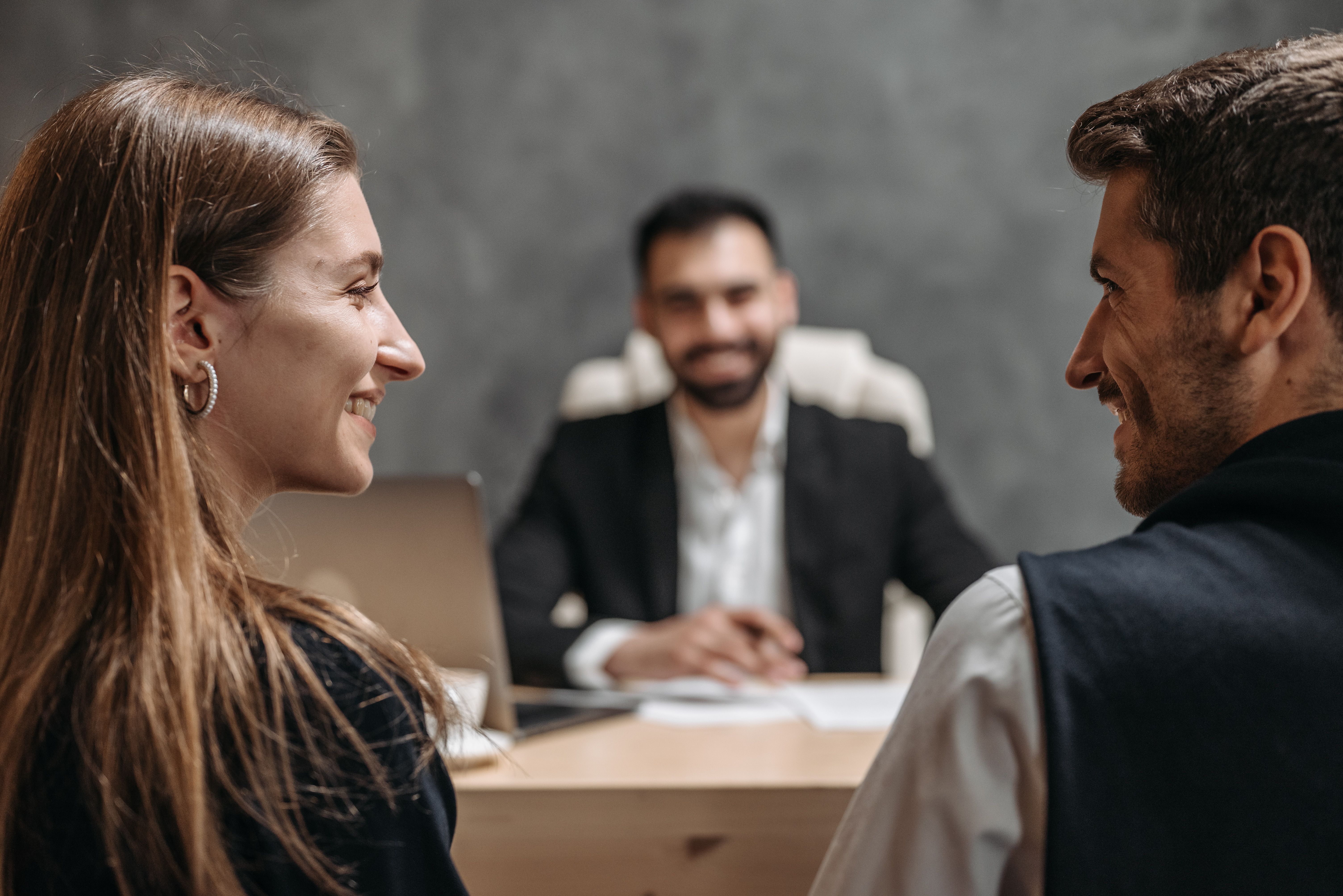 A meeting across the table with an advisor - governance kept human, not a black box.